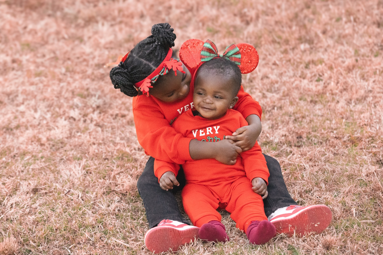 Two young children sharing a hug