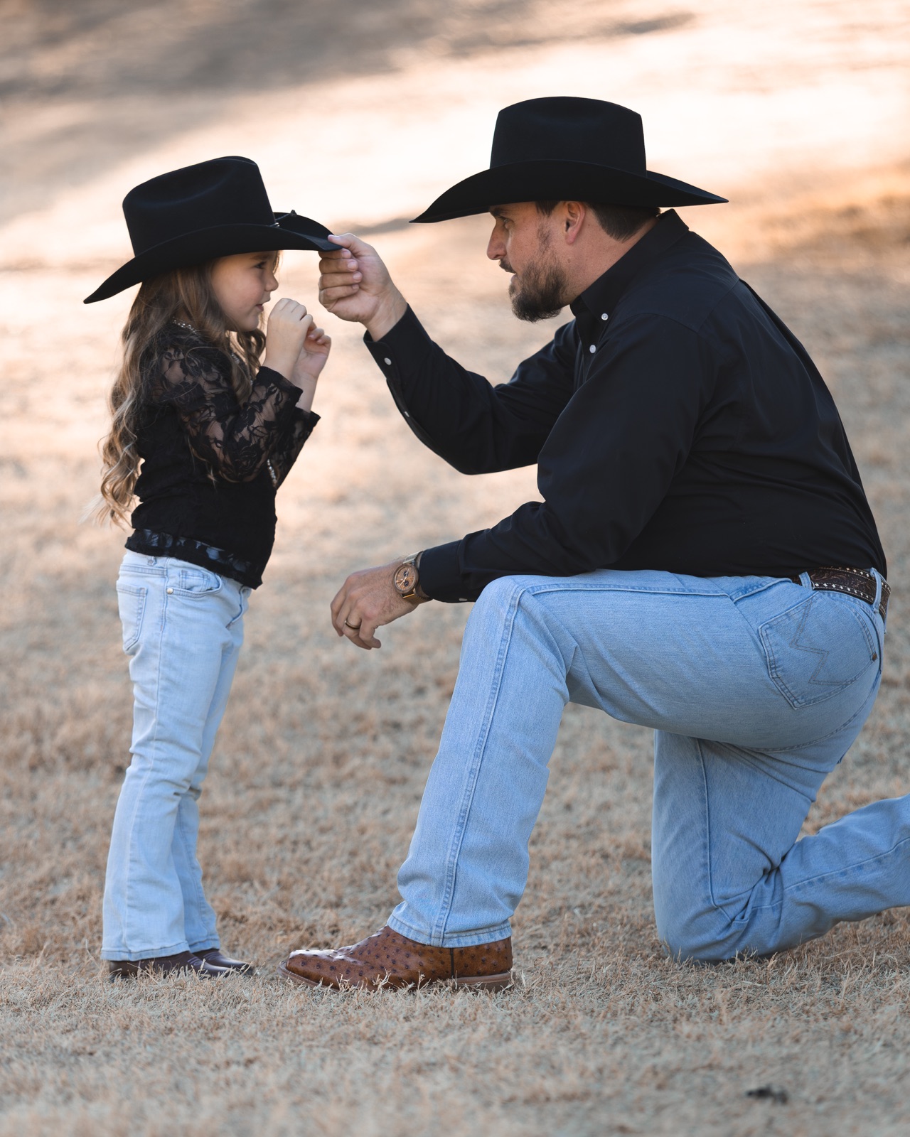 A father and daughter touching foreheads