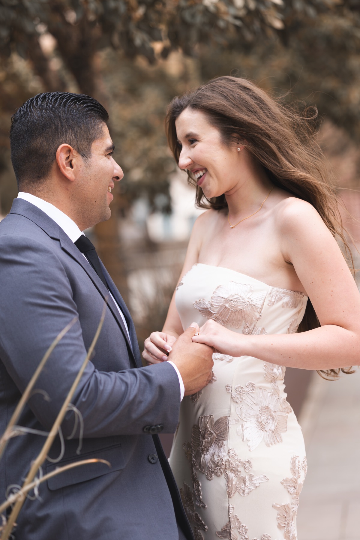 Andrew and Meghan laughing together outdoors